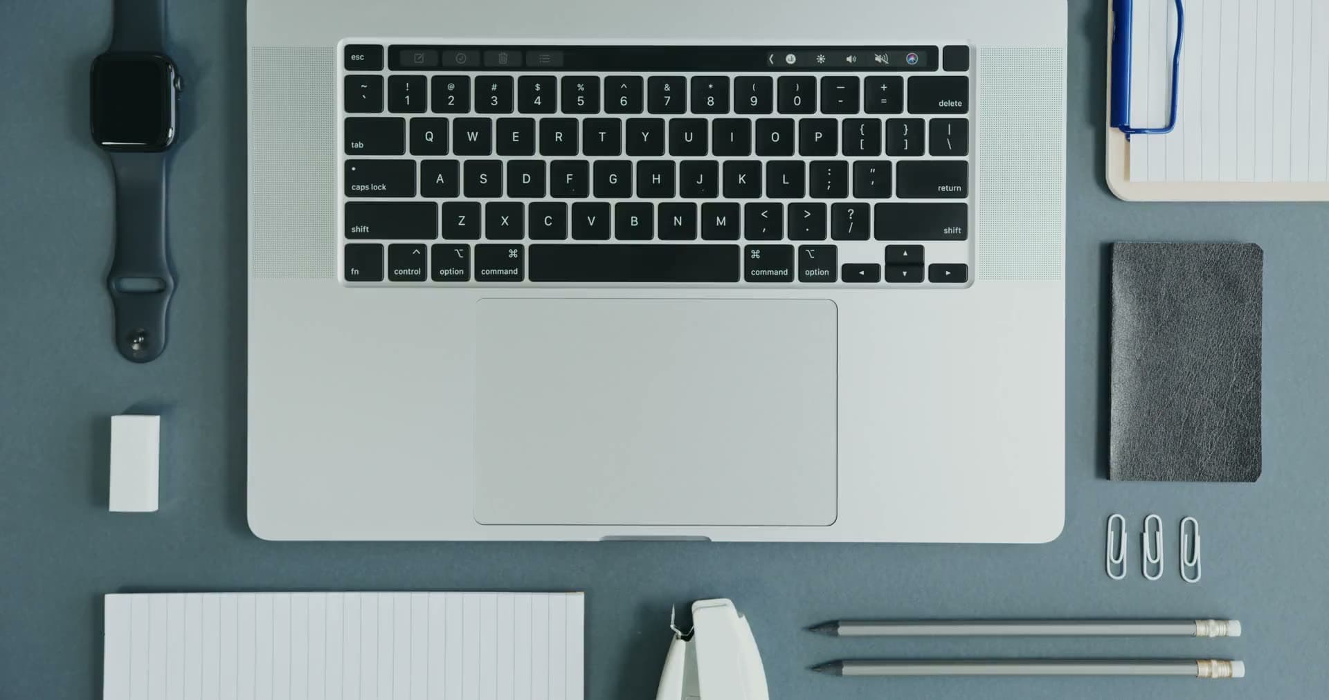 Modern team working at a laptop in a bright office
